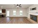 Living room showcases hardwood floors, fireplace, and plenty of natural light at 2375 Walker Dr, Hampton, GA 30228