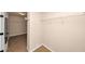 Walk-in closet with installed shelving and carpeted floor at 2375 Walker Dr, Hampton, GA 30228