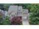 Aerial view of a well-maintained home surrounded by mature trees and beautiful landscaping at 326 Carmichael Cir, Canton, GA 30115