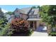 Aerial view of a well-maintained home surrounded by mature trees and beautiful landscaping at 326 Carmichael Cir, Canton, GA 30115