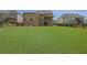 Expansive backyard with lush lawn, a charming fence, and an inviting patio seating area at 326 Carmichael Cir, Canton, GA 30115