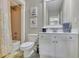 Bright bathroom featuring white vanity with a framed mirror, and a shower-tub combination at 326 Carmichael Cir, Canton, GA 30115