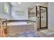 Modern bathroom with a soaking tub, shower with glass door and designer tile, creating a spa-like experience at 326 Carmichael Cir, Canton, GA 30115
