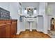 Charming bathroom featuring a pedestal sink, wood floors and granite countertop, offering a blend of classic design and modern amenities at 326 Carmichael Cir, Canton, GA 30115