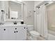 Modern bathroom featuring a shower/tub with a white vanity, toilet and tile floor, offering both style and functionality at 326 Carmichael Cir, Canton, GA 30115
