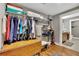 Walk-in closet with built-in shelving and ample storage for clothes and accessories at 326 Carmichael Cir, Canton, GA 30115