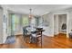 Charming dining area with hardwood floors, wainscoting, and ample natural light from large windows at 326 Carmichael Cir, Canton, GA 30115