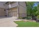 Side angle view of home's exterior with garage and manicured landscaping at 326 Carmichael Cir, Canton, GA 30115