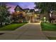 Stunning two-story home with manicured lawn and a porte cochere provides elegant curb appeal at 326 Carmichael Cir, Canton, GA 30115