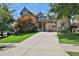 Stunning two-story home with manicured lawn and a porte cochere provides elegant curb appeal at 326 Carmichael Cir, Canton, GA 30115