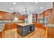 Spacious kitchen with hardwood floors, stainless steel appliances, and a large center island at 326 Carmichael Cir, Canton, GA 30115