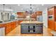 Charming kitchen with hardwood floors, a butcher block island, and stainless steel appliances at 326 Carmichael Cir, Canton, GA 30115