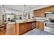 Open kitchen with granite countertops, stainless steel appliances and views of living room at 326 Carmichael Cir, Canton, GA 30115