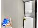 Functional laundry room featuring a stacked washer and dryer unit at 326 Carmichael Cir, Canton, GA 30115