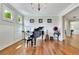 Comfortable living room with hardwood floors, a piano, and classic decor at 326 Carmichael Cir, Canton, GA 30115