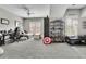 Spacious living area with comfortable seating, neutral tones, and shelving for collectables at 326 Carmichael Cir, Canton, GA 30115