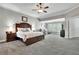 Spacious main bedroom with gray carpet, sitting area, and large bed at 326 Carmichael Cir, Canton, GA 30115