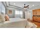 Bright main bedroom with tray ceiling, wood floors, and ample closet space at 326 Carmichael Cir, Canton, GA 30115