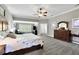 Spacious main bedroom with gray carpet, sitting area, and large bed at 326 Carmichael Cir, Canton, GA 30115