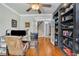 Well-appointed home office with hardwood floors, custom shelving, and ample workspace at 326 Carmichael Cir, Canton, GA 30115