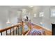 Bright landing on the second floor with hallway and staircase at 326 Carmichael Cir, Canton, GA 30115