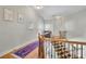 Hallway with wooden staircase and blue-red rug at 326 Carmichael Cir, Canton, GA 30115