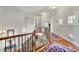 Wooden staircase with metal railing landing on the second floor at 326 Carmichael Cir, Canton, GA 30115