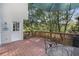 Comfortable outdoor deck area with a table and umbrella, perfect for relaxing with wooded views at 510 Birch Ridge Ct, Roswell, GA 30076