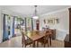Dining room with bay window, wooden table and chairs, and view to outside at 510 Birch Ridge Ct, Roswell, GA 30076