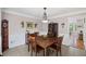 Traditional dining room with wooden table and chairs, tile flooring and china cabinet at 510 Birch Ridge Ct, Roswell, GA 30076