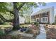 Charming brick home featuring lush landscaping and a welcoming walkway to the front door at 510 Birch Ridge Ct, Roswell, GA 30076