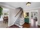 Inviting foyer with hardwood floors, staircase, and access to the living and dining areas at 510 Birch Ridge Ct, Roswell, GA 30076