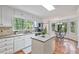 Bright kitchen with white cabinetry, stainless steel appliances, and a cozy breakfast nook at 510 Birch Ridge Ct, Roswell, GA 30076