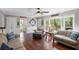 Bright living room featuring hardwood floors, neutral paint, and natural light from large windows at 510 Birch Ridge Ct, Roswell, GA 30076