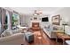 Spacious living room with a brick fireplace and hardwood floors, offering a cozy atmosphere at 510 Birch Ridge Ct, Roswell, GA 30076