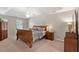Spacious main bedroom with trey ceilings, ceiling fan, sitting area and lots of natural light at 510 Birch Ridge Ct, Roswell, GA 30076