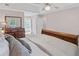 Main bedroom with trey ceilings, dark wood furnishings and ensuite bathroom at 510 Birch Ridge Ct, Roswell, GA 30076