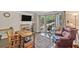 Office with natural light, hardwood floors, vintage furniture, chair and golf clubs at 510 Birch Ridge Ct, Roswell, GA 30076