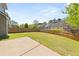 Large, level backyard with a concrete patio, perfect for outdoor activities and entertaining at 5209 Carrington Park Dr, Powder Springs, GA 30127