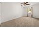 Bedroom with neutral carpet, ceiling fan, and window at 5209 Carrington Park Dr, Powder Springs, GA 30127