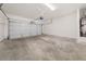 Spacious garage with a concrete floor, providing ample parking and storage space at 5209 Carrington Park Dr, Powder Springs, GA 30127
