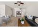 Comfortable living room featuring neutral walls, neutral carpet, and a staircase to the upper level at 5209 Carrington Park Dr, Powder Springs, GA 30127