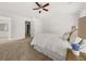 Spacious main bedroom with large windows, ceiling fan, and neutral decor at 5209 Carrington Park Dr, Powder Springs, GA 30127