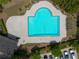 Aerial view of a community pool with clear water, ample seating, and parking at 5209 Carrington Park Dr, Powder Springs, GA 30127