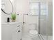 Bright bathroom featuring a glass enclosed shower, modern vanity with new fixtures, and marble floors at 561 Allendale Dr, Decatur, GA 30032