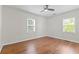 Bright and airy bedroom featuring hardwood floors, ceiling fan, and lots of natural light at 561 Allendale Dr, Decatur, GA 30032