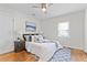 Cozy bedroom featuring hardwood floors, a ceiling fan, and ample natural light at 561 Allendale Dr, Decatur, GA 30032