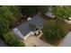 Aerial view of a one-story home with a gray roof, long driveway, and partially covered front porch at 70 Summer Walk Dr, Covington, GA 30016