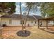 Backyard area with a fire pit, grill, partial fencing, well-maintained lawn, and a white home exterior at 70 Summer Walk Dr, Covington, GA 30016