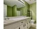 Bright bathroom featuring a double sink vanity with white cabinetry and plenty of counter space at 70 Summer Walk Dr, Covington, GA 30016